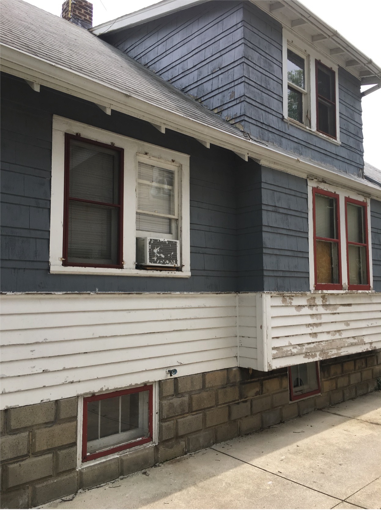 home exterior with peeling paint