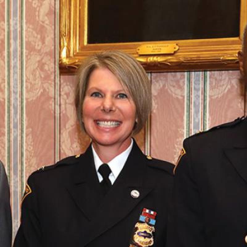 bibb, dorthy todd and police chief stand for picture