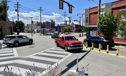 street intersection with crosswalks truck and car