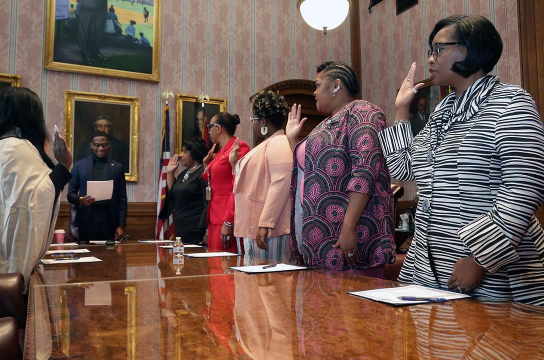 women taking pledge