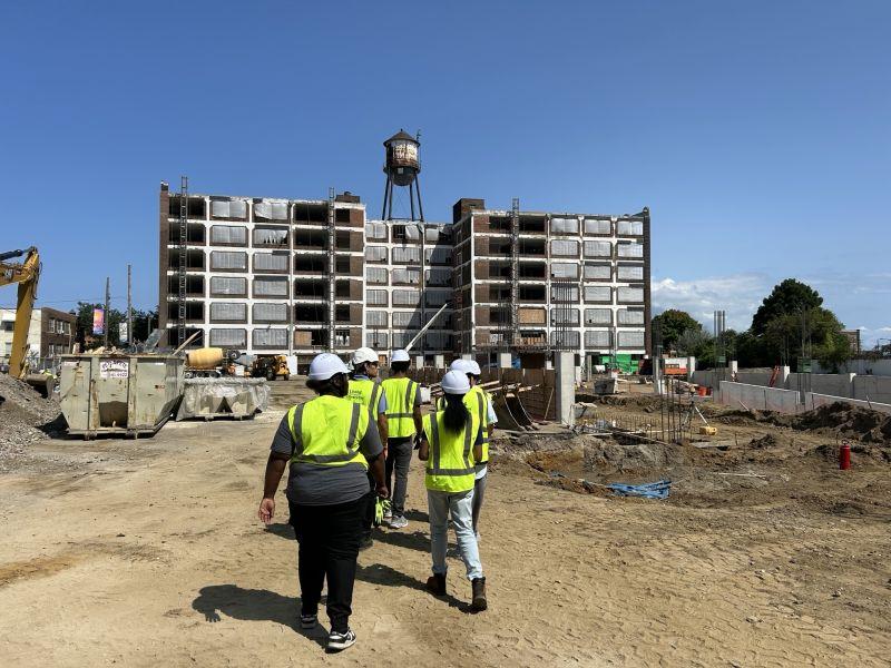 construction workers walking towards construction site