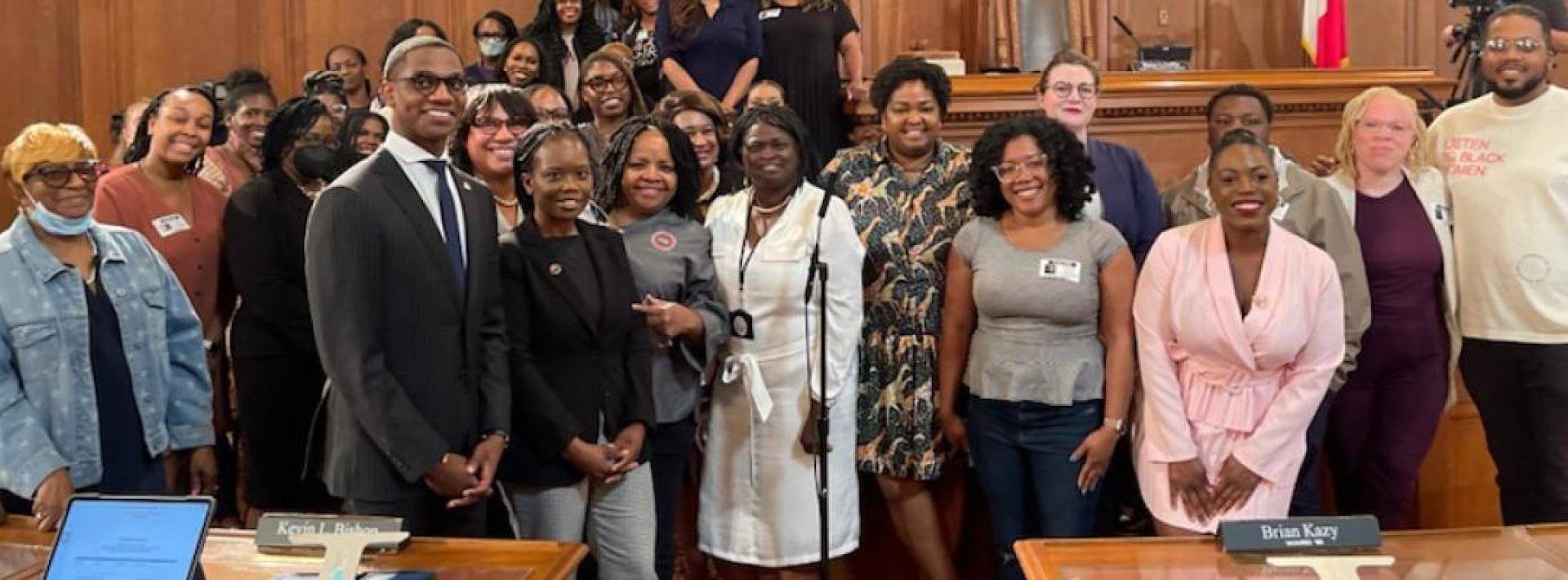 a group of women surround mayor bibb 